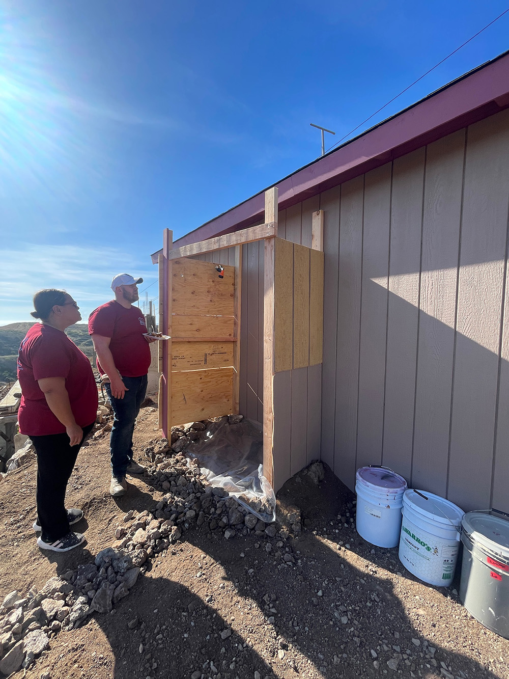 Nathan Evans, Medasource Director of Sales Enablement & Education, shows off the first ever outdoor shower added to a Home Build home.